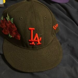 Black and red LA hat